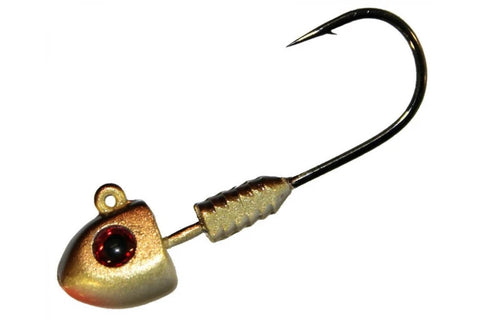 A gold-colored jig fishing lure with a ribbed metal neck, a red eye, and a black hook, shown against a plain white background.