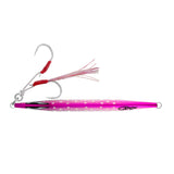 A pink and red jig fishing lure with a white skirt and two treble hooks, shown against a plain white background.