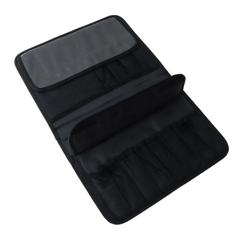 A black fabric makeup organizer roll-up case shown open, featuring a clear plastic sleeve on the top flap, card slots, and elastic loops on a plain white background.